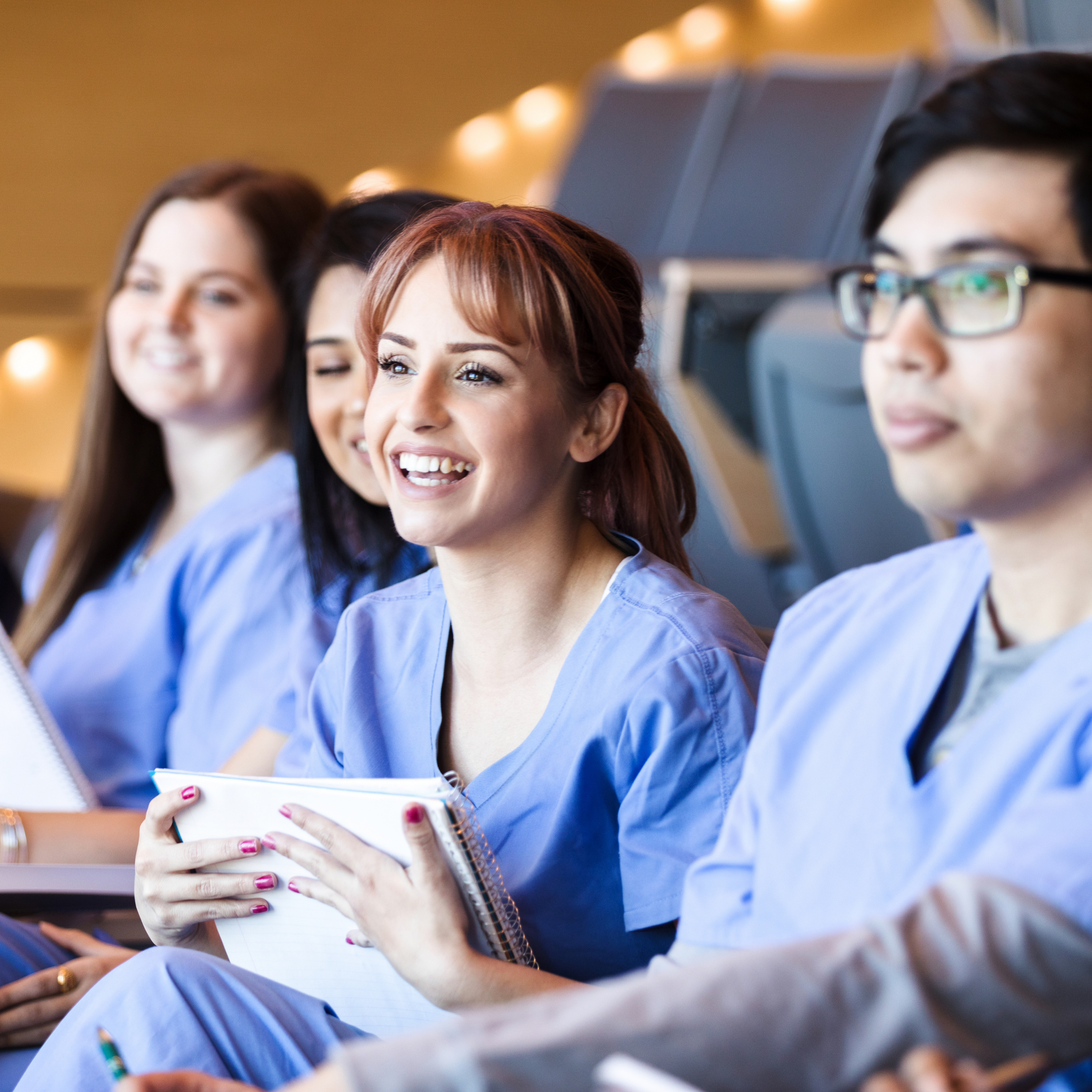 Female Doctors Smiling at Conference