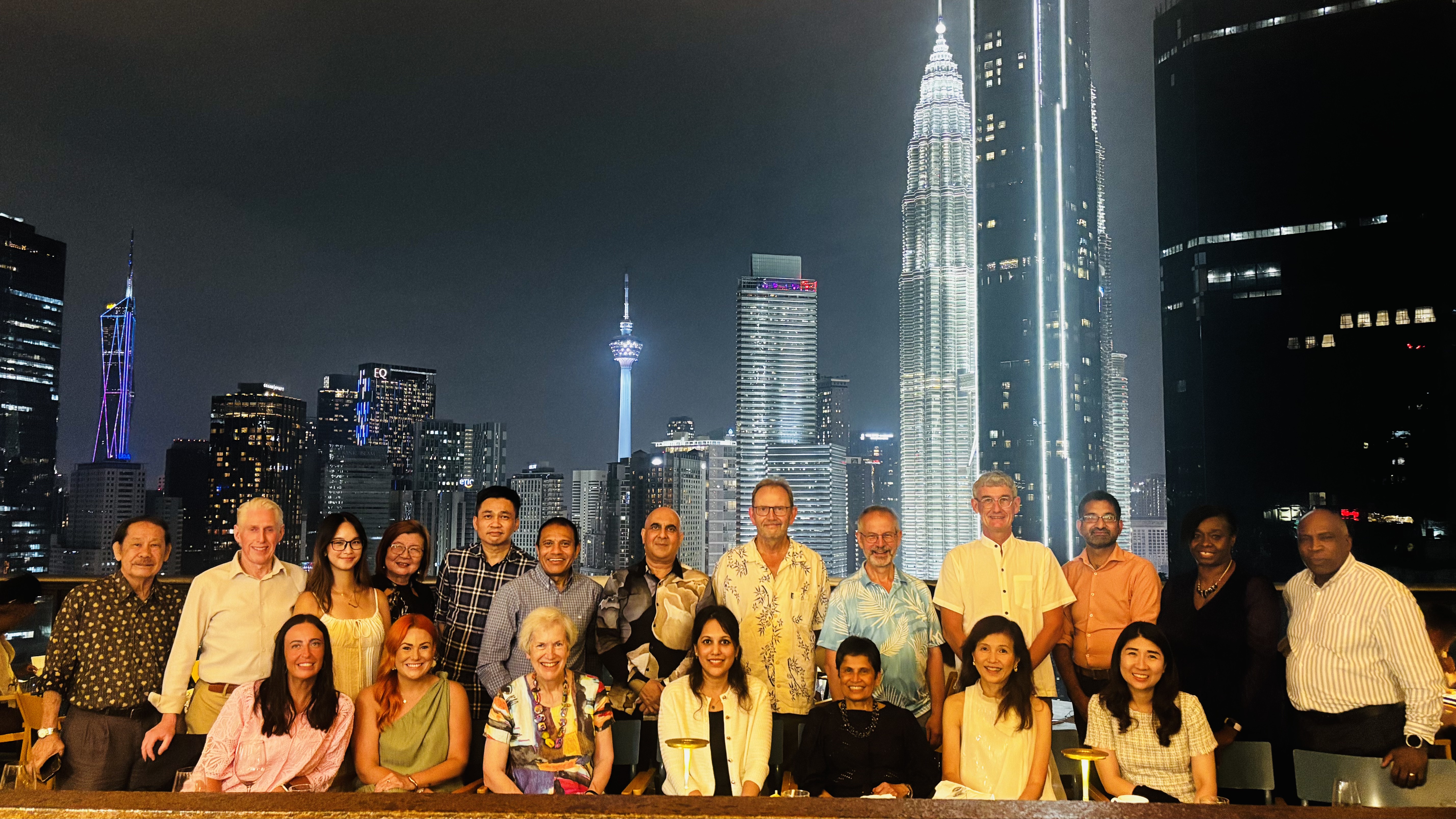 The examiners with the Kuala Lumpur skyline